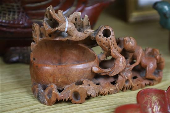 Two Chinese soapstone carvings, a lacquered wood duck, two lacquer stands and a brushpot, duck W.24cm